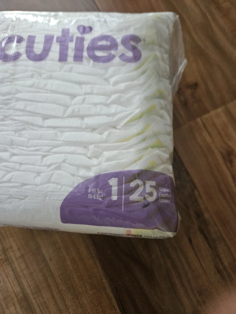 Cuties Baby Diapers Pack - White with Purple Logo Size 1